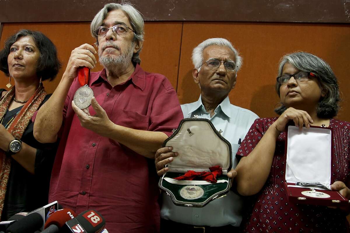 From left, Madhushree Dutta, Saeed Mirza, Kundan Shah and Irene Malik Dhar who are among Indian film industry figures returning National Film Awards pose before the media in Mumbai, India, Thursday, Nov. 5, 2015. Booker Prize-winning novelist Arundhati Roy and two dozen Bollywood award winners added their voices to the artists, scientists and historians who say they are alarmed by a climate of religious intolerance and violence in India.(AP Photo/Rajanish Kakade)