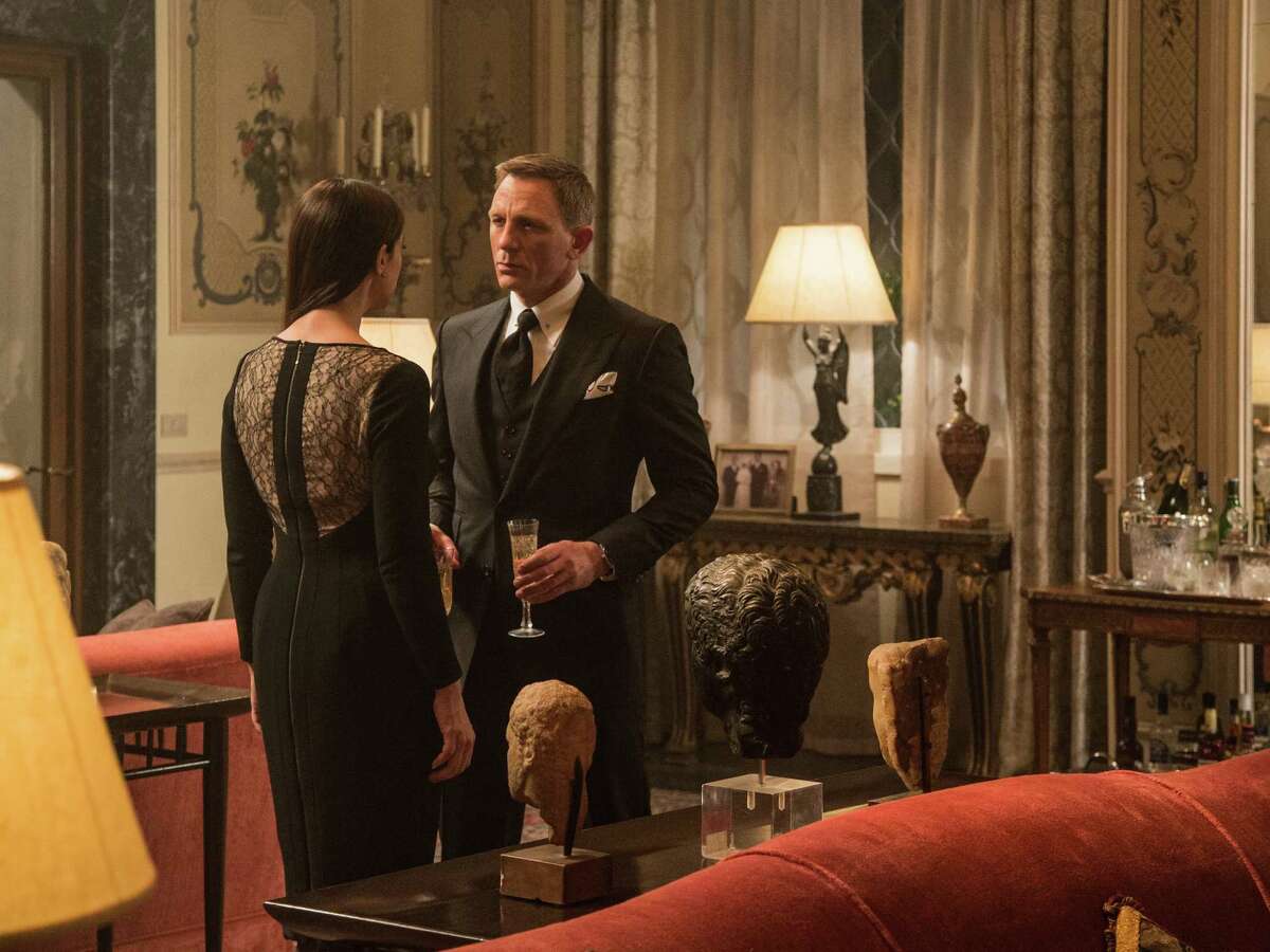 In this image released by Metro-Goldwyn-Mayer Pictures/Columbia Pictures/EON Productions, Monica Bellucci, left, and Daniel Craig appear in a scene from the James Bond film, "Spectre." The movie releases in U.S. theaters on Nov. 6, 2015. (Jonathan Olley/Metro-Goldwyn-Mayer Pictures/Columbia Pictures/EON Productions via AP) ORG XMIT: NYET176