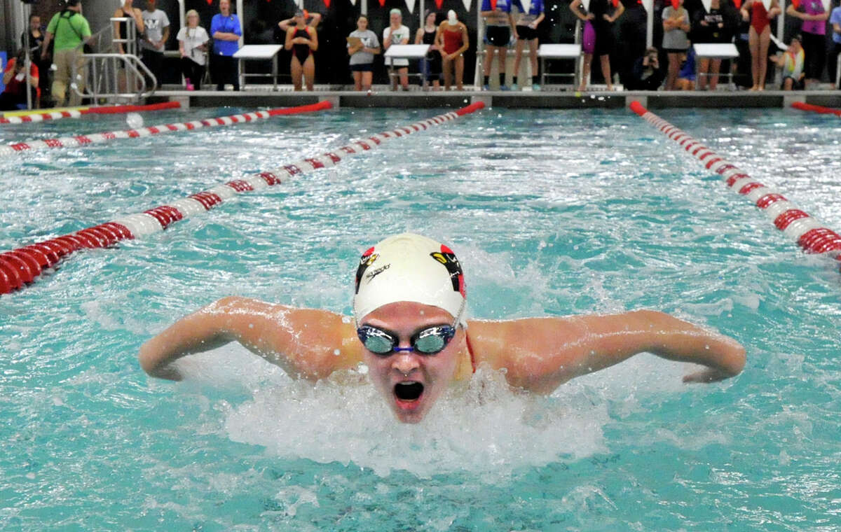 Greenwich’s Kelly Montesi competes in the 100-yard butterfly during the FCIAC girls swimming championship Thursday at Greenwich High School. She placed sixth with a time of 59.79 seconds. New Canaan won the championship and Ridgefield was second.