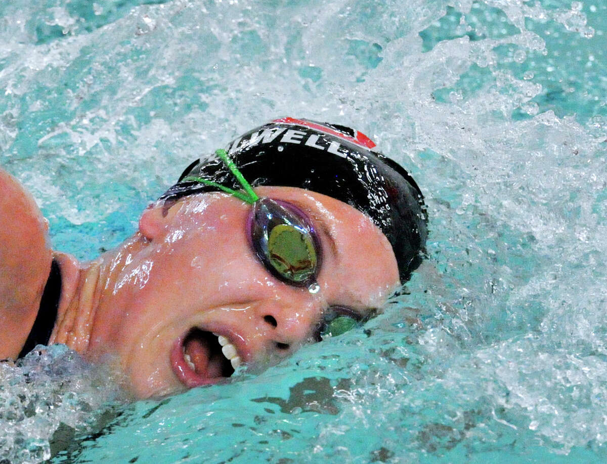 New Canaan’s Elizabeth Colwell competes in the 500 freestyle event during the girls FCIAC swimming championship at Greenwich High School on Thursday.