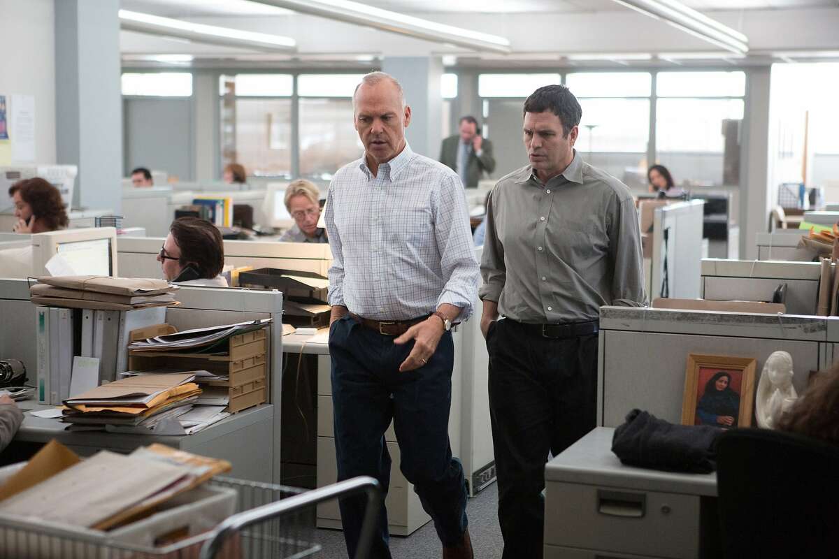 This photo provided by courtesy of Open Road Films shows, Michael Keaton, left, as Walter "Robby" Robinson and Mark Ruffalo as Michael Rezendes, in a scene from the film, "Spotlight." (Kerry Hayes/Open Road Films via AP)