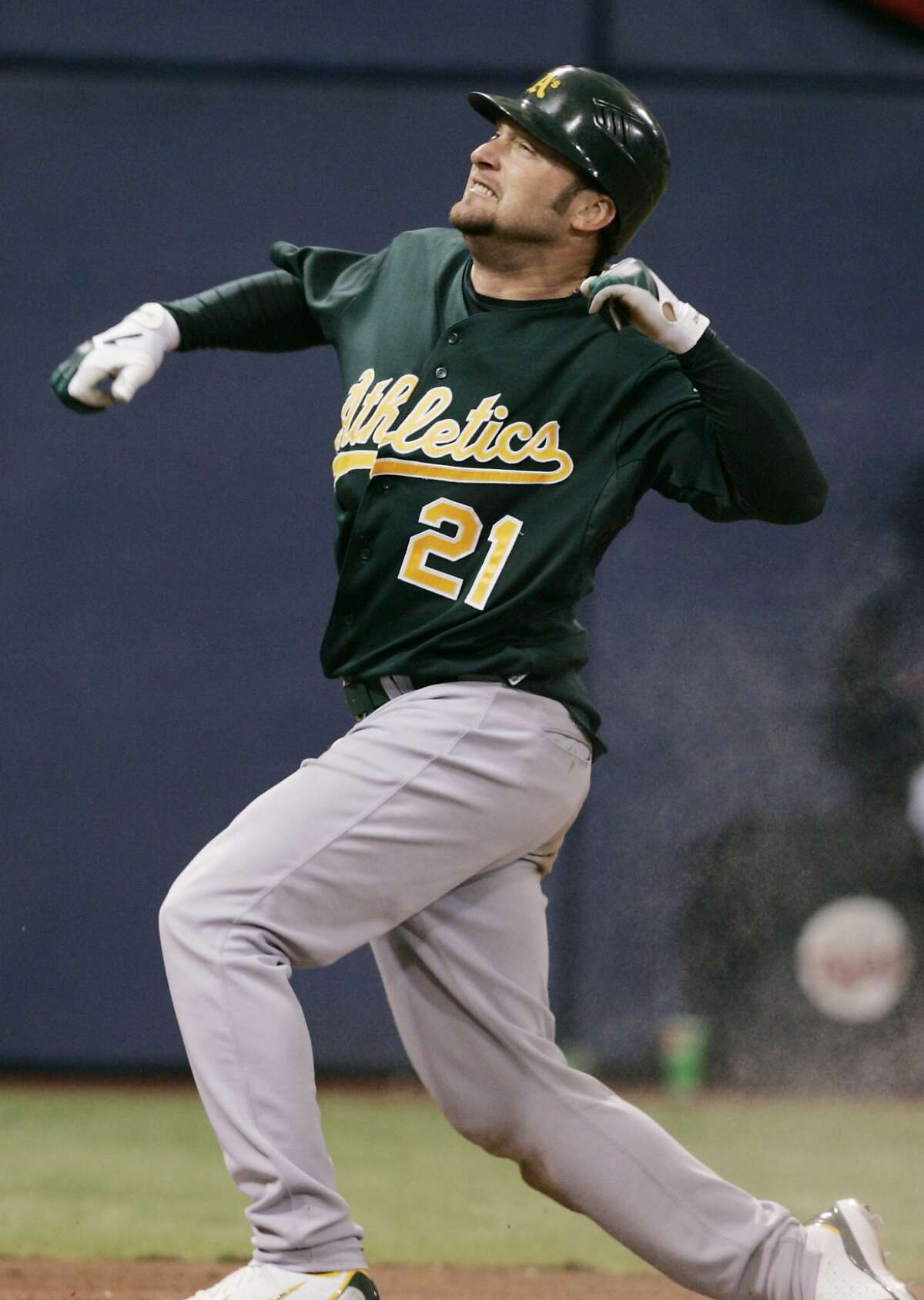 Oakland Athletics' Mark Kotsay celebrates his two-run inside-the-park homer off Minnesota Twins' Pat Neshek in seventh inning in Game 2 of the American League Division Series baseball game Wednesday, Oct. 4, 2006 in Minneapolis. (AP Photo/Jim Mone) Ran on: 10-08-2006