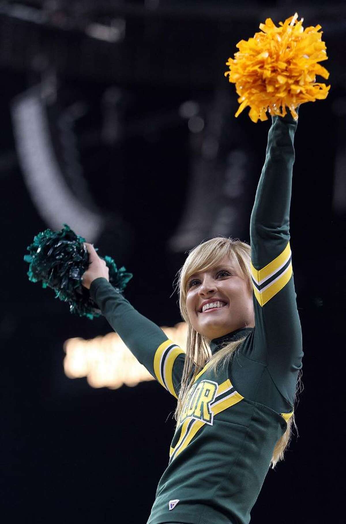 HOUSTON - MARCH 26: A Baylor Bears cheerleader during play against the St. Mary's Gaels during the south regional semifinal of the 2010 NCAA men's basketball tournament at Reliant Stadium on March 26, 2010 in Houston, Texas. (Photo by Ronald Martinez/Getty Images)