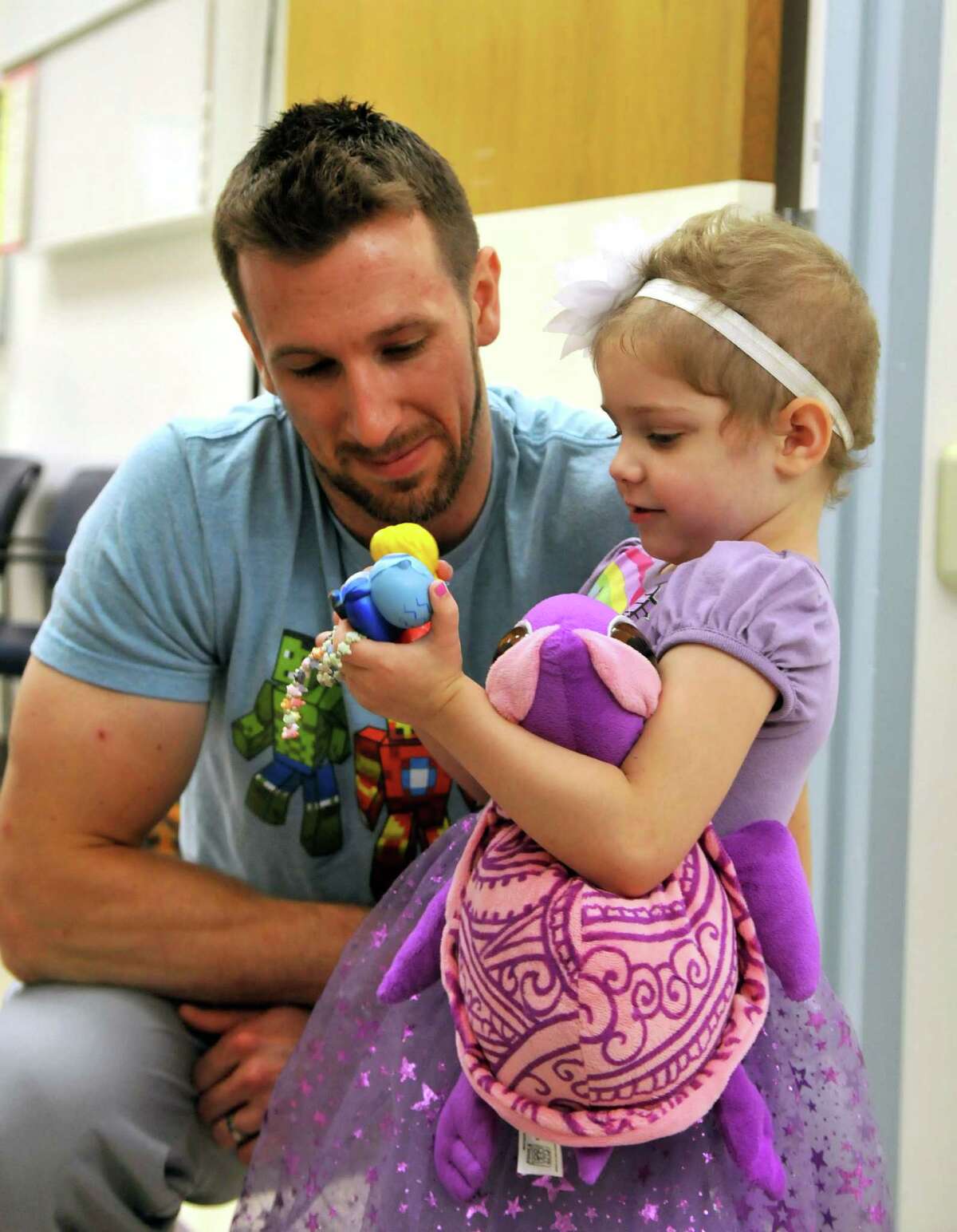 Abby Sayles hangs out with Nurse Matt Hickling on Friday, July 17, 2015, at Albany Medical Center in Albany, N.Y. Abby had a wedding ceremony with her favorite nurse, Matt Hickling, yesterday at the Melodies Center for Childhood Cancers at AMC. (Phoebe Sheehan/Special to The Times Union)