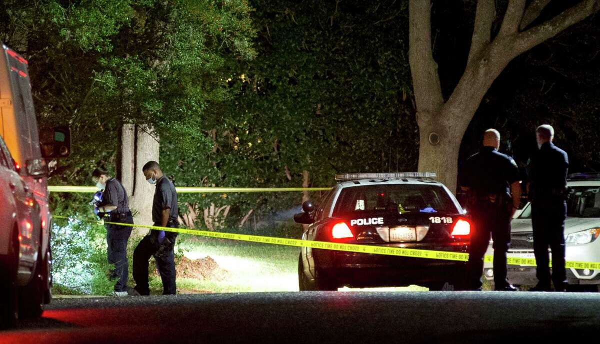 Authorities investigate the scene Saturday, Nov. 7, 2015, where District Judge Julie Kocurek was shot on Friday night in the driveway of her home in Austin, Texas. (Jay Janner/Austin American-Statesman via AP) AUSTIN CHRONICLE OUT, COMMUNITY IMPACT OUT, INTERNET AND TV MUST CREDIT PHOTOGRAPHER AND STATESMAN.COM, MAGS OUT; MANDATORY CREDIT