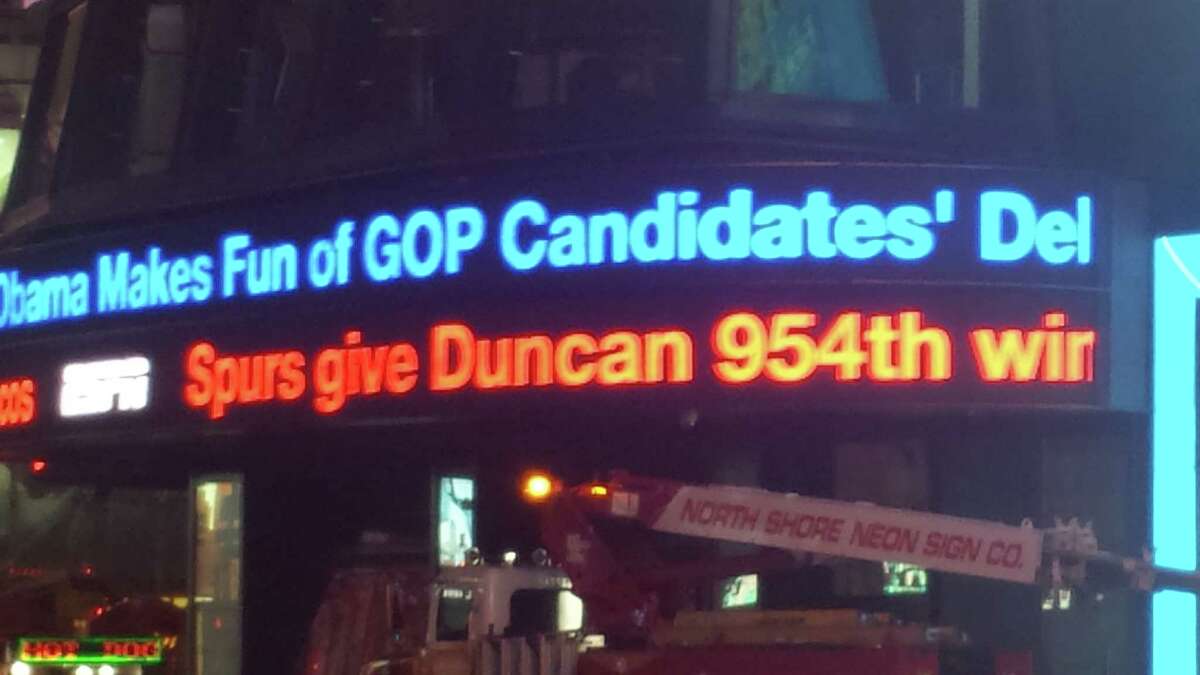 In Times Square after midnight, a familiar name scrolls by on the sports ticker.