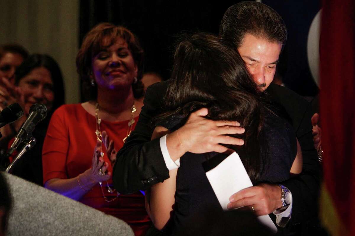 Houston mayoral candidate Adrian Garcia hugs his daughter after conceding the race at his watch party last week.