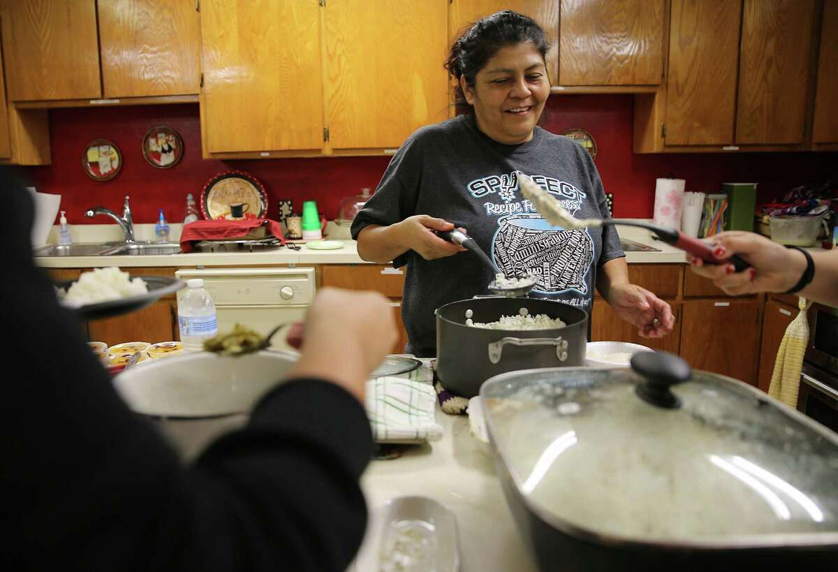 Connie Martinez serves up dinner for herself as she prepares to spend the night at the Hospitality House before visiting her husband on Friday, Oct. 30, 2015, in Huntsville, Texas.