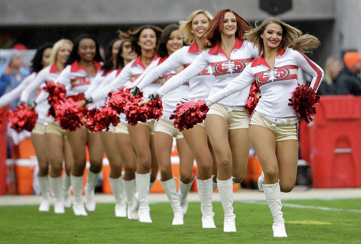 Francisco 49ers cheerleaders perform before an NFL football game between th...