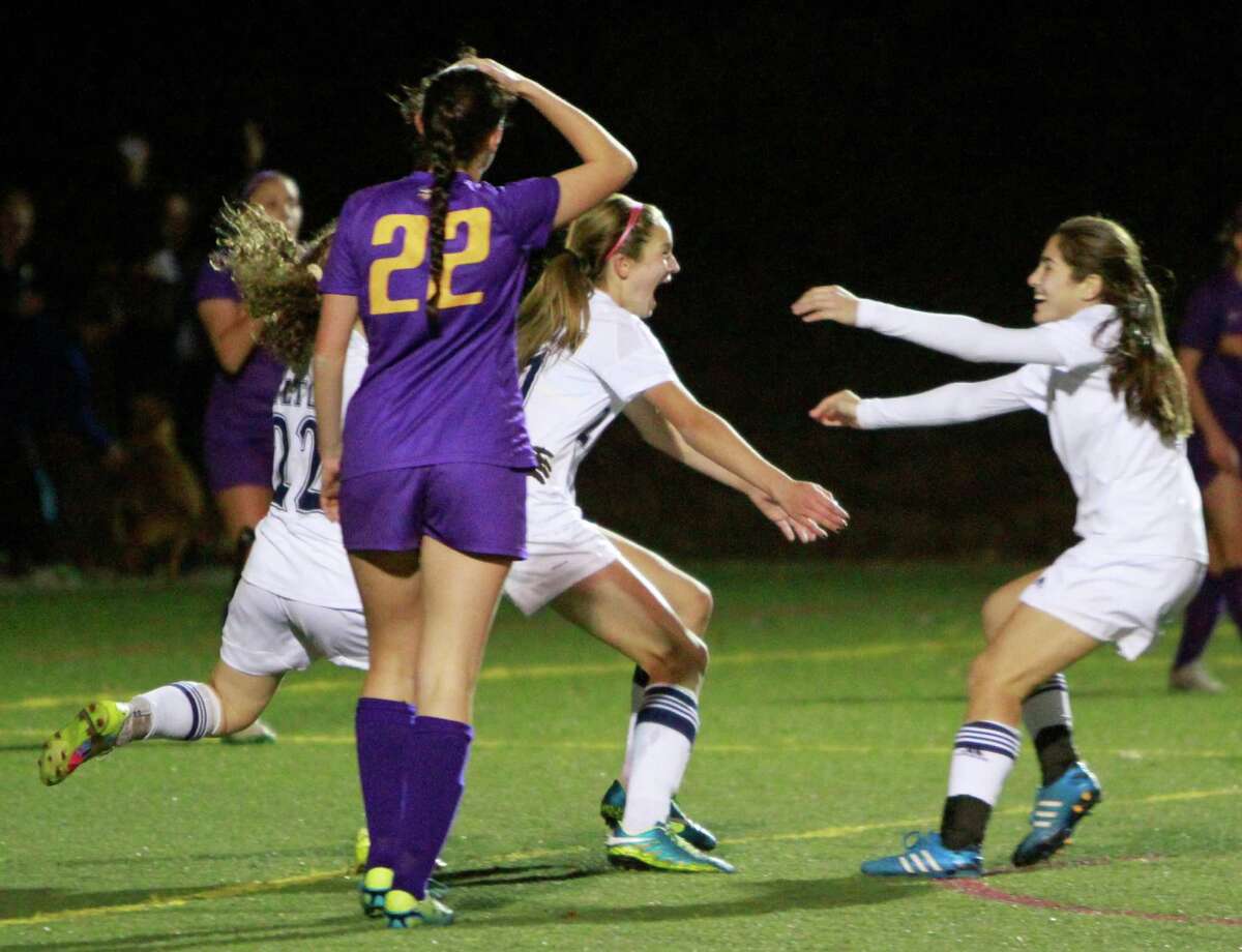 Wilton's Alexandra DeJena, center, celebrates her goal against Westhill with her teammates during a FCIAC first round Class LL girls soccer game on Nov. 9, 2015 in Wilton. Witon won 1-0.