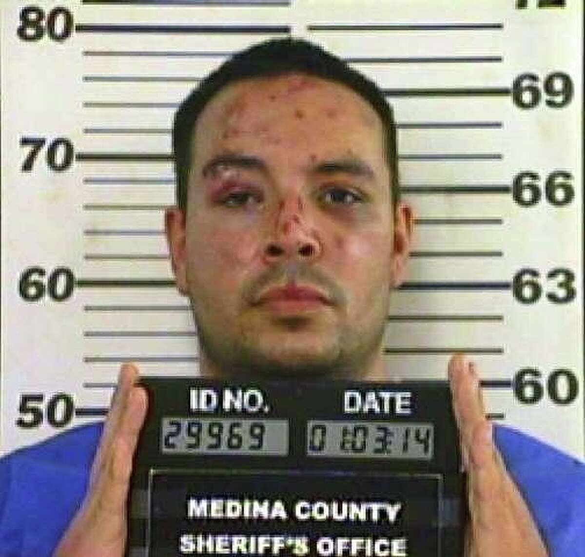 Border patrol agent Adam Scott Garibay is seen in a Jan. 3, 2014 booking mug provided by the Medina County Sheriff's department. Garibay pleaded guilty Nov. 9, 2015 to killing Keith Martin just outside Hondo.