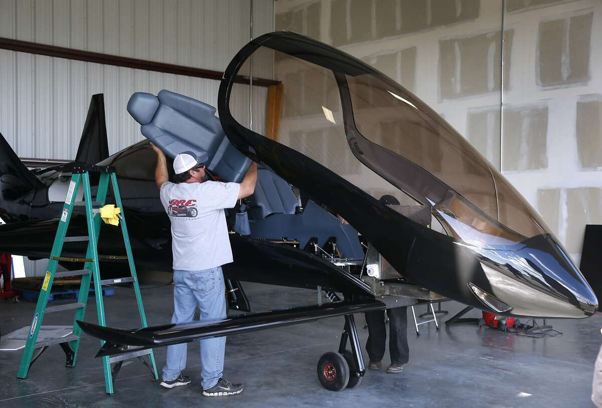 Todd Latronica installs a seat into the cockpit during final assembly of the Cobalt Co50 Valkyrie airplane at Hayward Executive Airport in Hayward, Calif. on Tuesday, Nov. 10, 2015, ahead of its debut on Thursday.