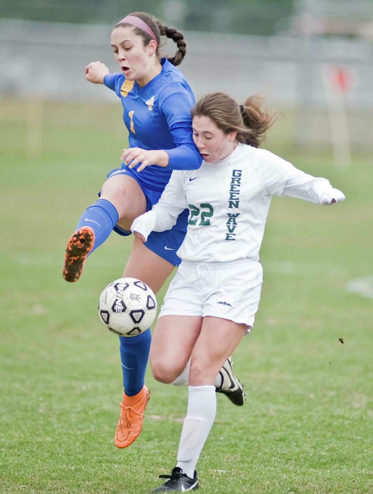 Mercy High School's Camille Gilarde and New Milford High School's Kelly Marsan come together in the Class LL game at New Milford. Wednesday, Nov. 11, 2015