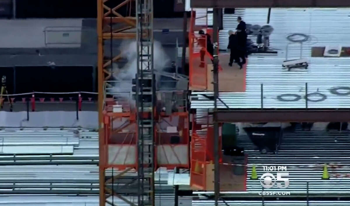 San Francisco Police release a flash bomb grenade at an elevator shaft where the shooter was perched.