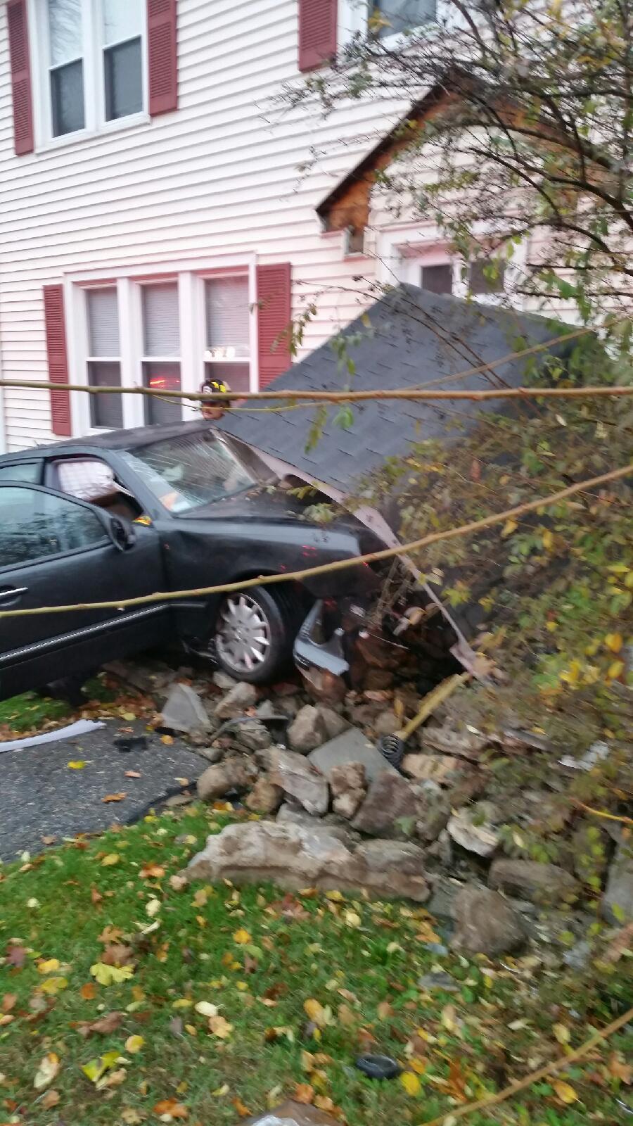 Stamford driver in critical condition after crashing into home