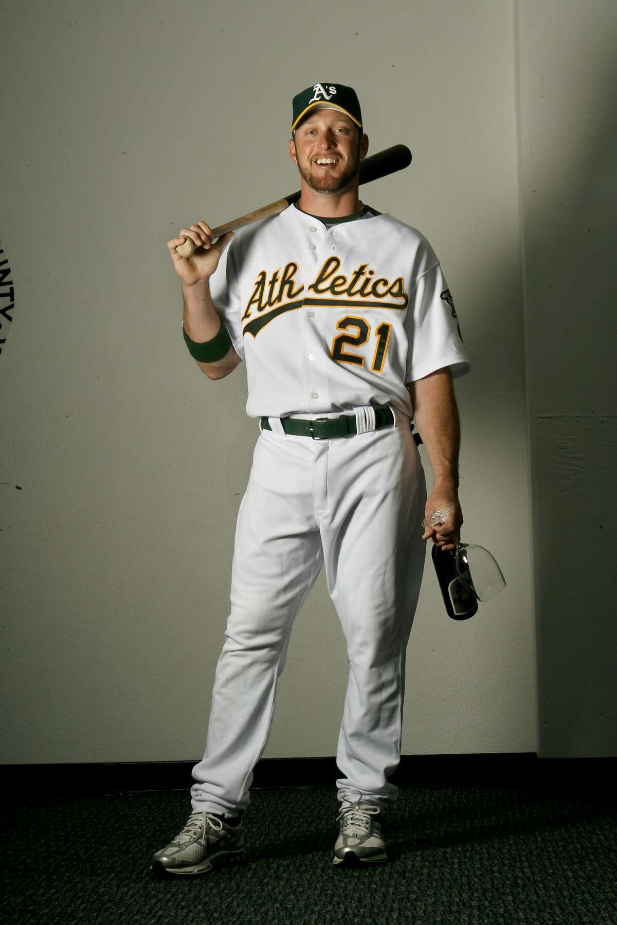 QUARRY_134_KW_.jpg Oakland Athletics center fielder #21 Mark Kotsay poses with a bottle of wine at McAfee Coliseum in Oakland Tuesday August 15, 2006. Kat Wade/The Chronicle **Mark Kotsay (Subject) cq