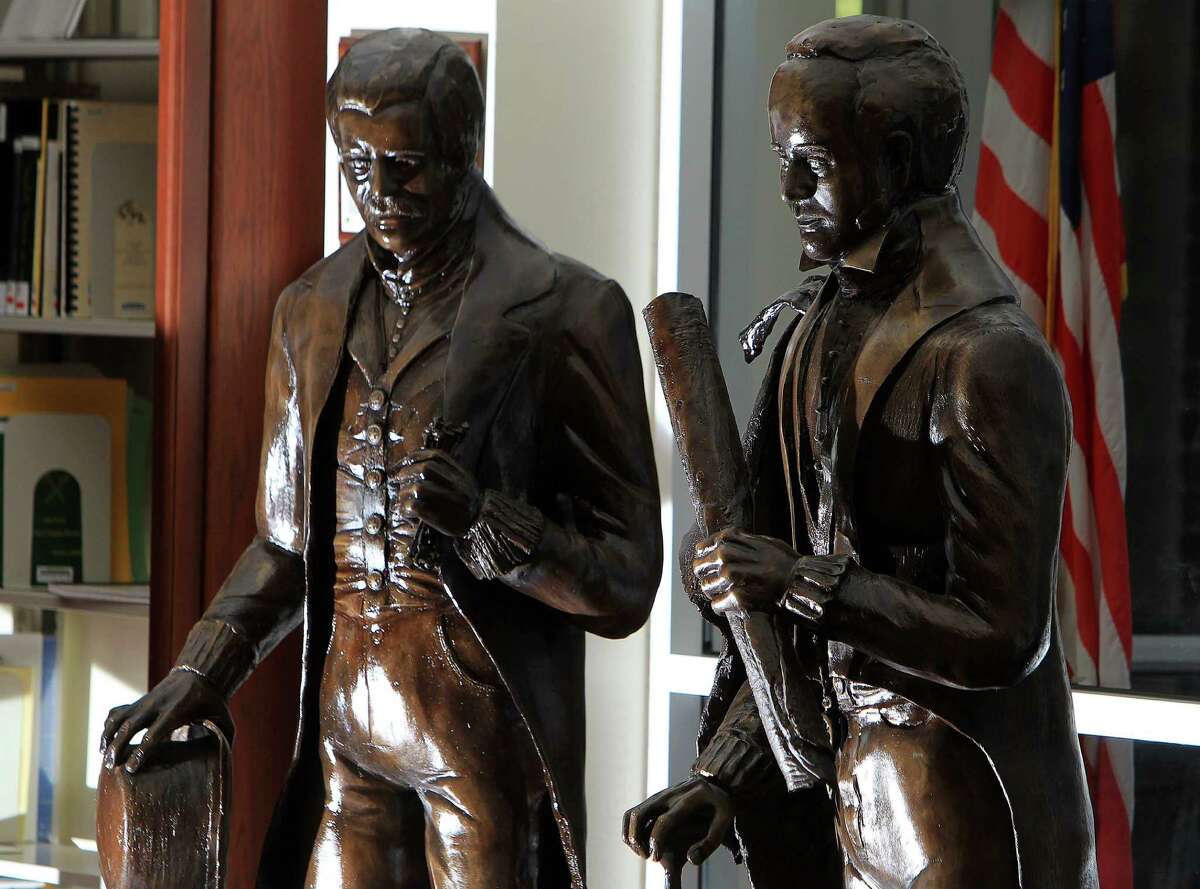 Statues of the Allen brothers, Augustus Chapman Allen (left) and John Kirby Allen (right), were created by artist Lori Betz in 2015 to be installed at the east entrance to city hall later this month. ( Mark Mulligan / Houston Chronicle )