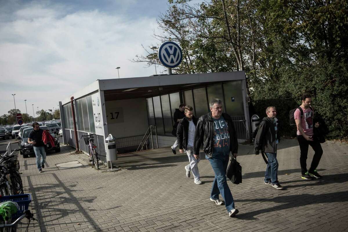 Workers leave after a morning shift last month at the Volkswagen factory in Wolfsburg, Germany. VW announced an amnesty program for informants that will expire at the end of the month. The offer excludes top management.