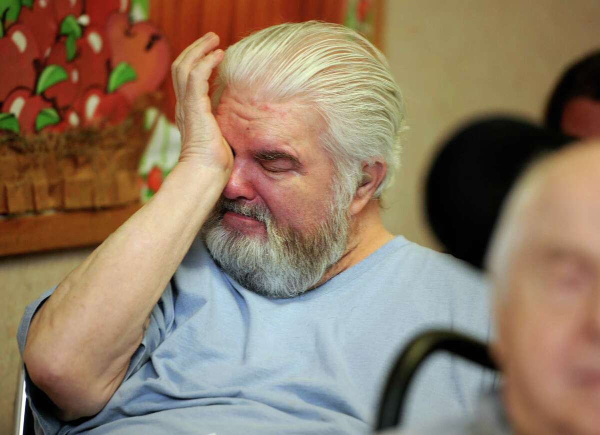 Resident Milton Brackett wipes his eyes after talking about how much the Smith House Nursing and Rehabilitation Center in Stamford means to him Friday, Nov. 13, 2015, during a public hearing to discuss the city's request to close the facility.