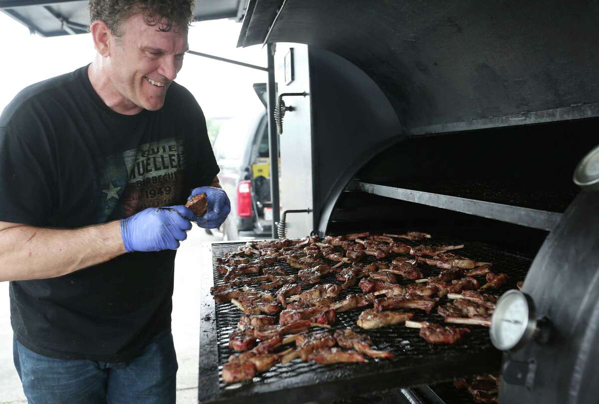 Wayne Mueller of Louis Mueller Barbecue in Taylor grills lamb chops.