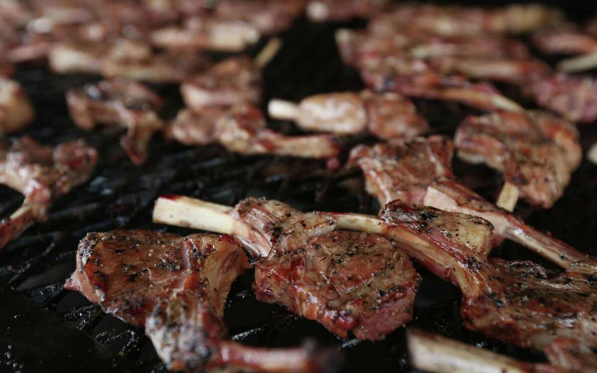 Lamb chops from Louie Mueller Barbecue are seen cooking at the 3rd annual Houston Barbecue Festival Sunday, April 26, 2015, at NRG Park. ( Jon Shapley / Houston Chronicle )