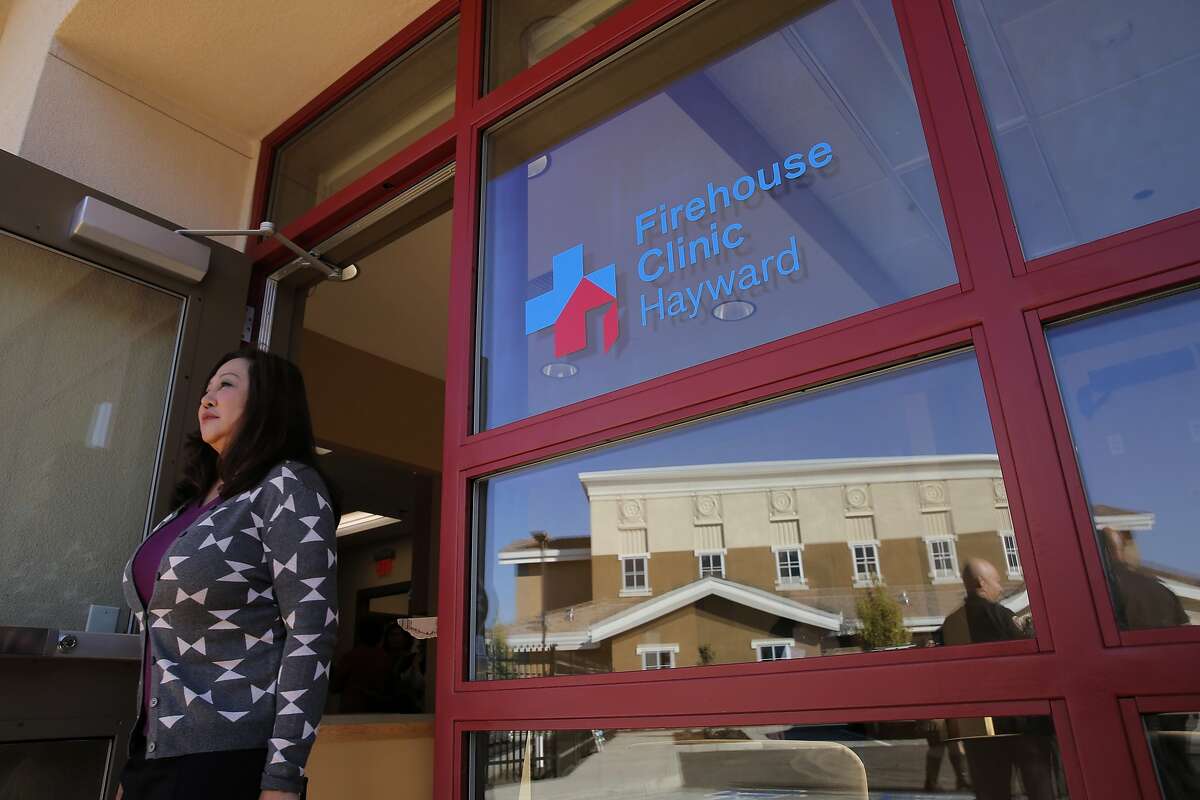 Visitors tour the new facility as city officials open the new Firehouse Clinic which shares the property with Hayward Fire's Station Number 7, which is reflected in the front window, in Hayward, Calif. on Fri. November 13, 2015.