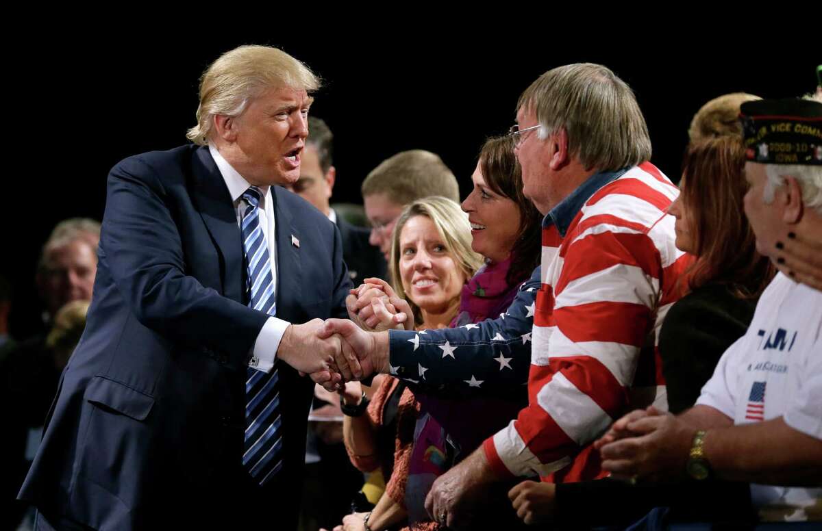 Republican presidential candidate Donald Trump greets supporters before speaking at a rally at Iowa Central Community College, Thursday, Nov. 12, 2015, in Fort Dodge, Iowa. (AP Photo/Charlie Neibergall)
