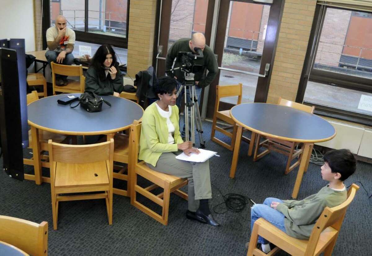 A Western Connecticut State University Professor, Marsha Daria, is filming a documentary on multiracial children. Daria and the film crew where filming at Broadview Middle School in Danbury on Monday March 29, 2010. From left, film crew Renato Ghio, Rebecca Woodward and cameraman Scott Volpe all of WCSU media services, Professor Marsha Daria, center, and Broadview student Jonathan Garcia, 11.