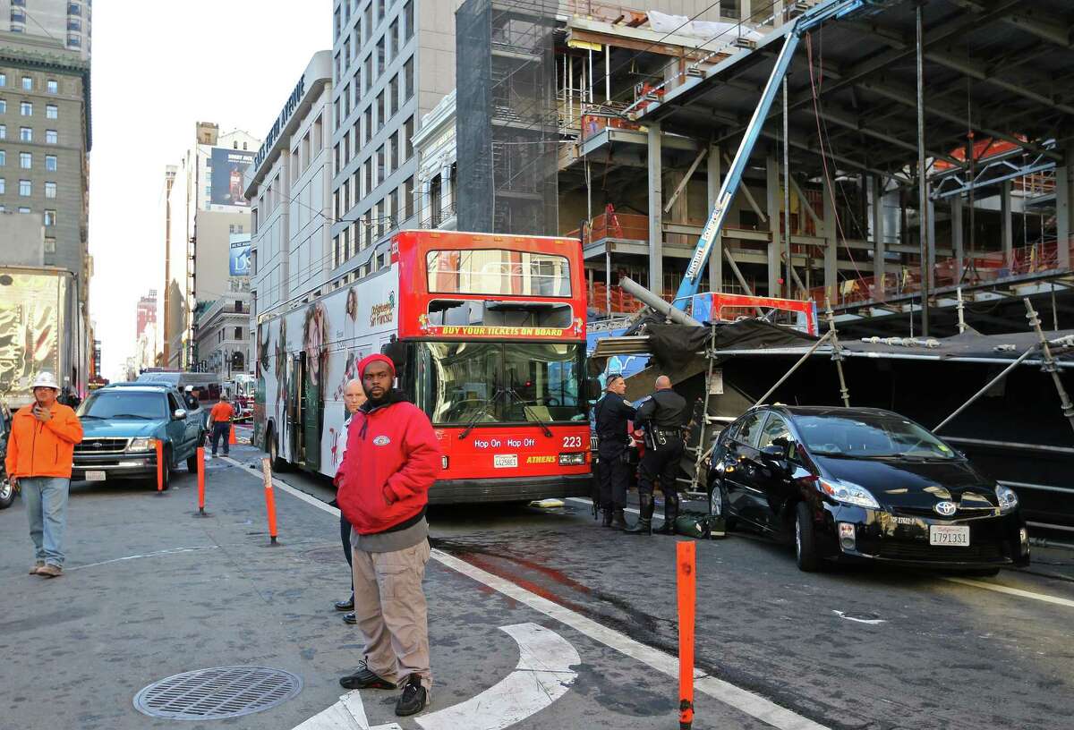Officials are still trying to determine what caused a City Sightseeing San Francisco bus to careen out of control in Union Square and crash into cars and then scaffolding at a construction site.