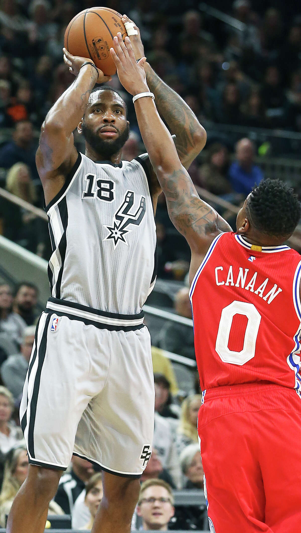 Spurs’ Rasual Butler puts up a jumper against the 76ers’ Isaiah Canaan at the AT&T Center on Nov. 14, 2015.