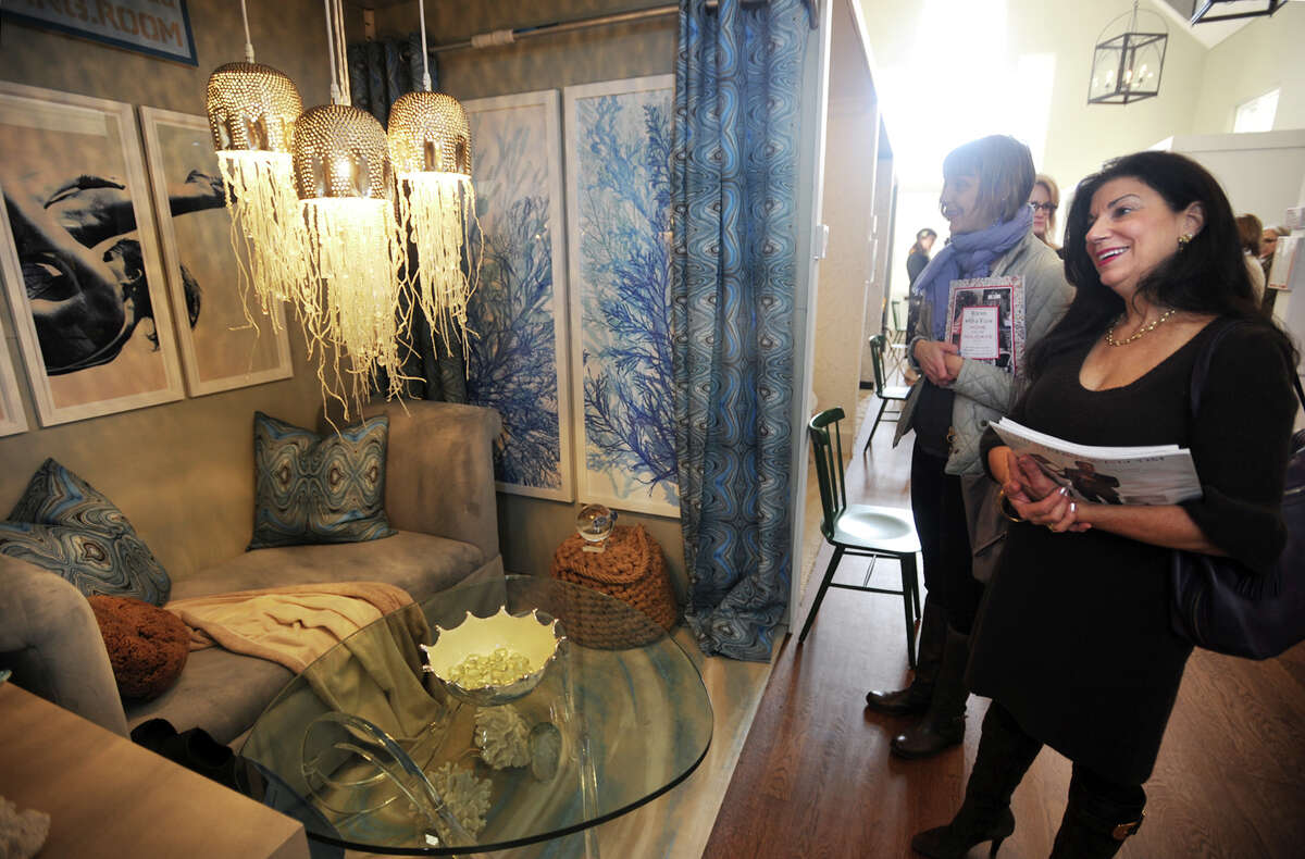 Kirsten Etela, left, and Lisa Rolleri, both of Fairfield, check out "The Diving Room", designed by Tracy Dwyer and Patrick Briel, at the annual Rooms with a View interior design showcase at the Southport Congregational Church in Fairfield, Conn. on Sunday, November 15, 2015. Rooms this year were designed around the theme "I'll Be Home for Christmas".