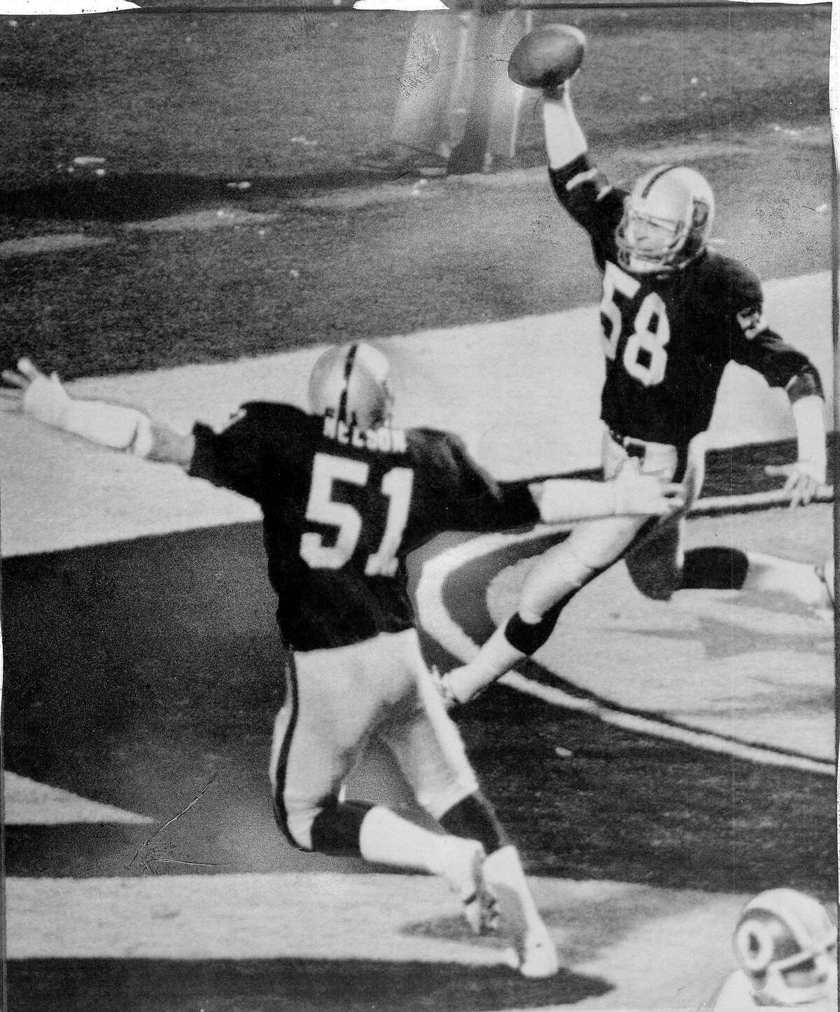 Jack Squirek intercepts a screen pass and runs it in for a touchdown in Super Bowl XVIII. vs the Washington Redskins January 23, 1984