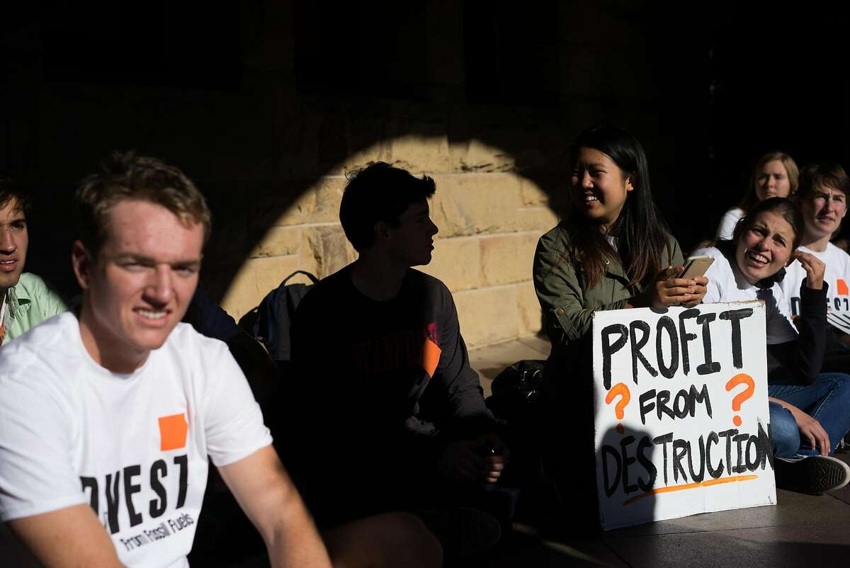 Students host a sit in in front of the president's office at Stanford University in Palo Alto, Calif. on Monday, Nov. 16, 2015. Students demanded that the university divest from its financial ties to fossil fuels.