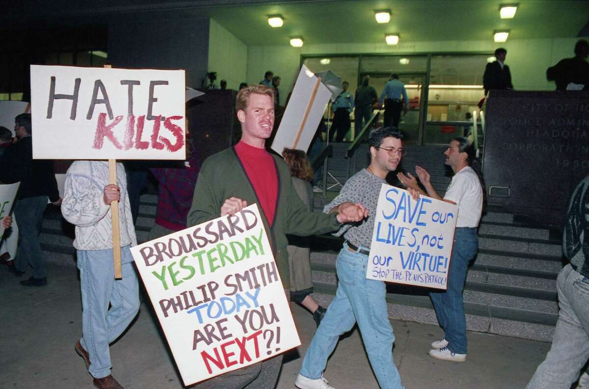 November 6, 1991: Protesters march outside Houston Police Department headquarters to demand action in the killing of Phillip W. Smith, 24, outside a gay bar. It was the second anti-gay murder in Montrose in four months.