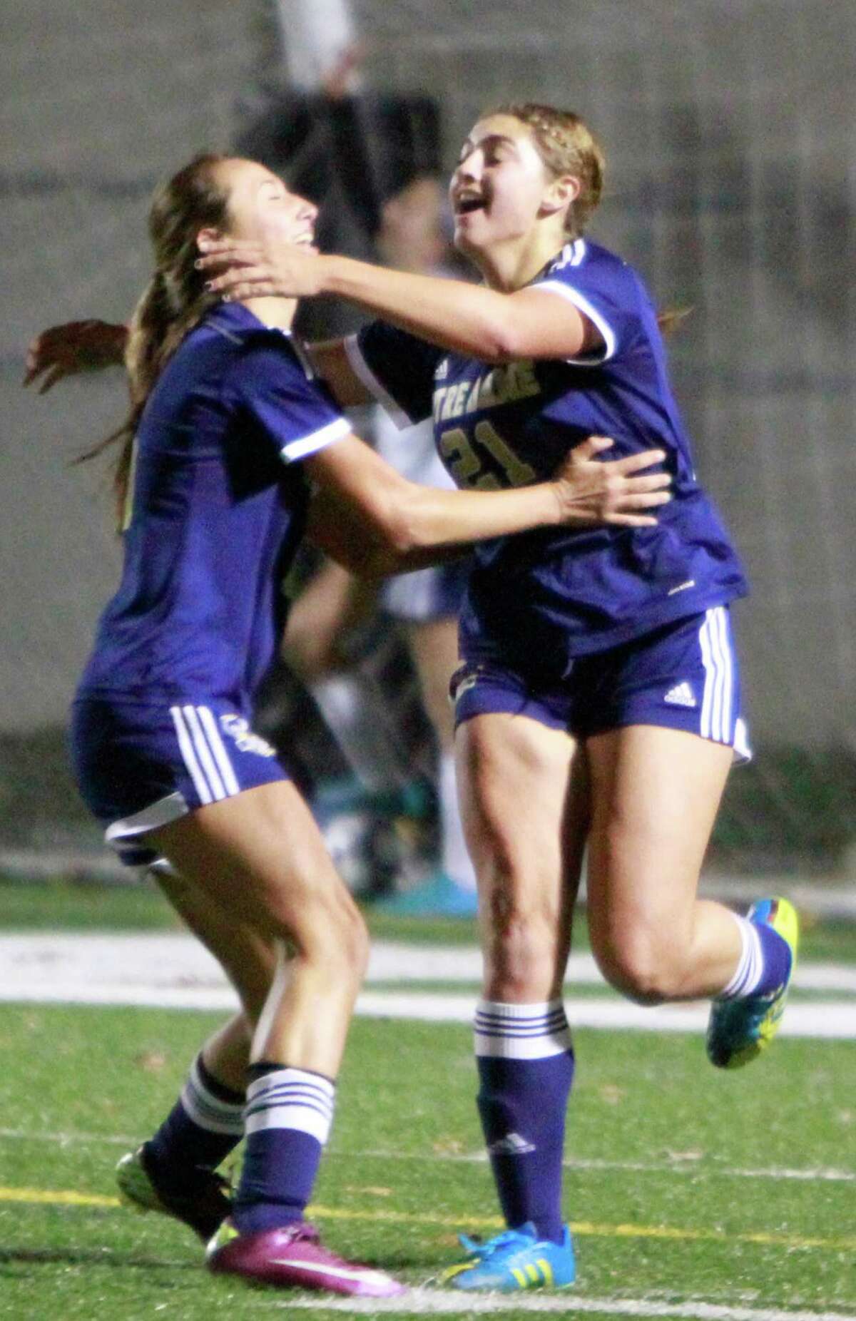 Notre Dame-Fairfield's Samantha LaValle, at right, celebrates her first half goal against Bolton with teammate Katie Ciufo in a CIAC Class S semi final girls soccer game on Nov. 16, 2015 in Meriden.