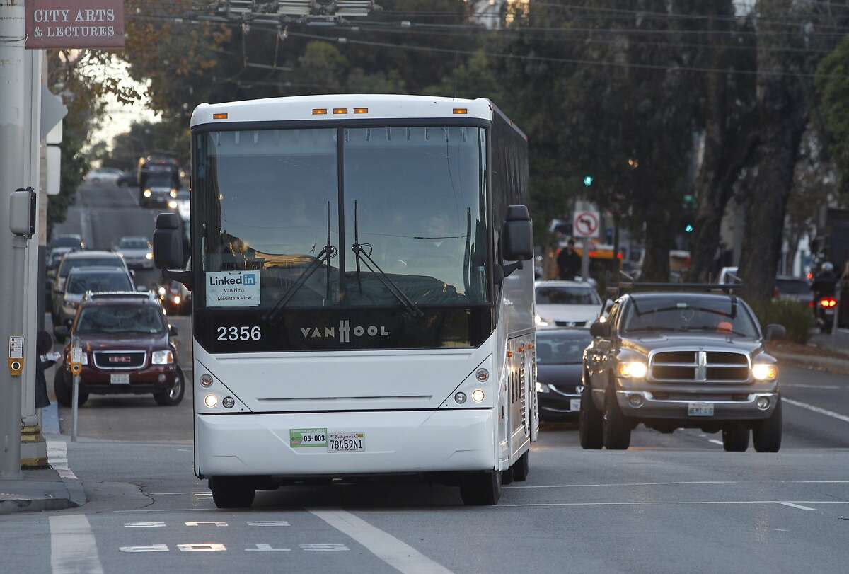 A commuter bus arrives at Van Ness Avenue and McAllister Street in San Francisco, Calif. to pick up LinkedIn employees and shuttle them to Mountain View on Tuesday, Nov. 17, 2015