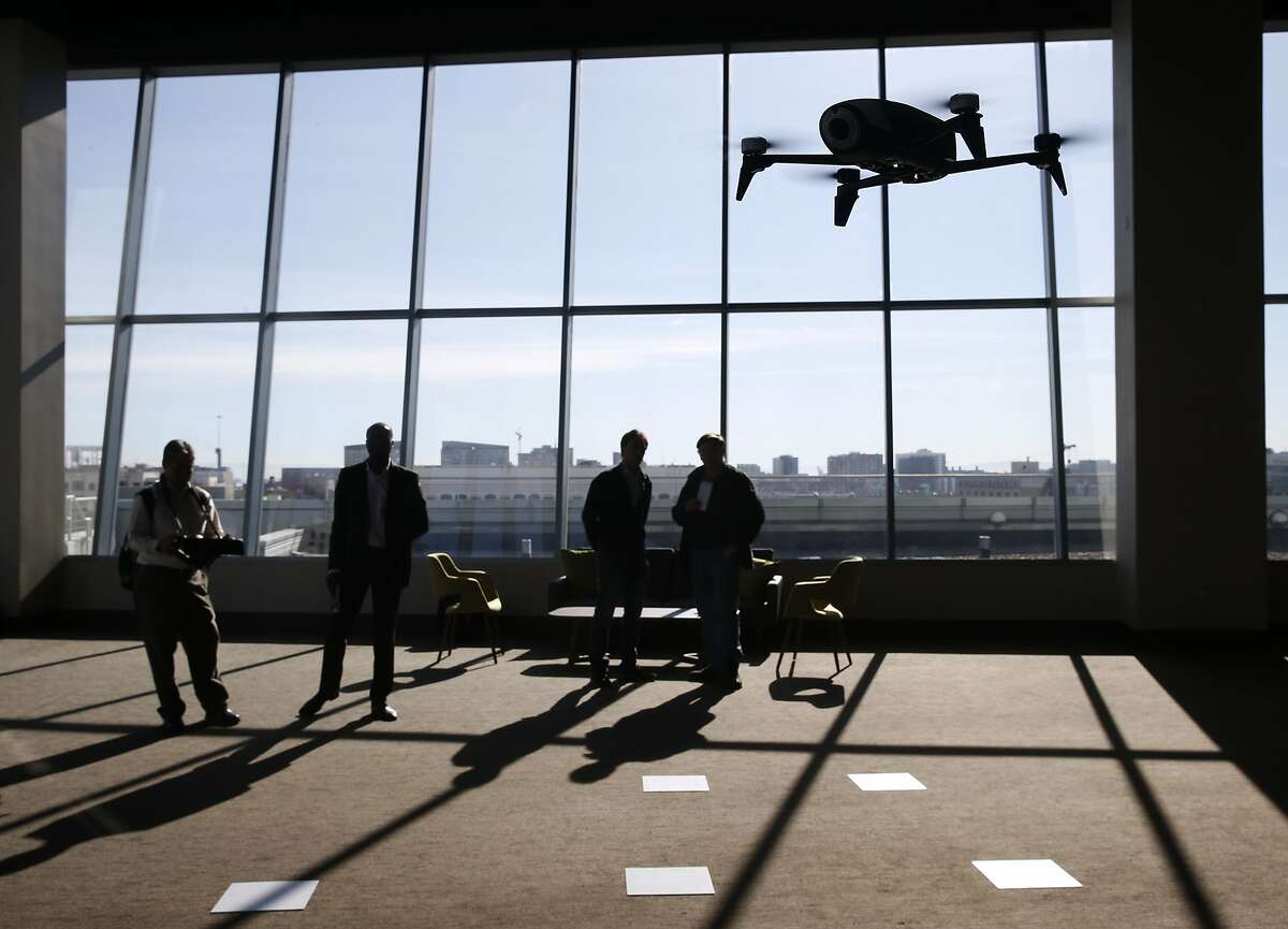 Invited guests take a test flight of the Parrot Bebop Drone 2, which was introduced at a news conference in San Francisco, Calif. on Tuesday, Nov. 17, 2015.