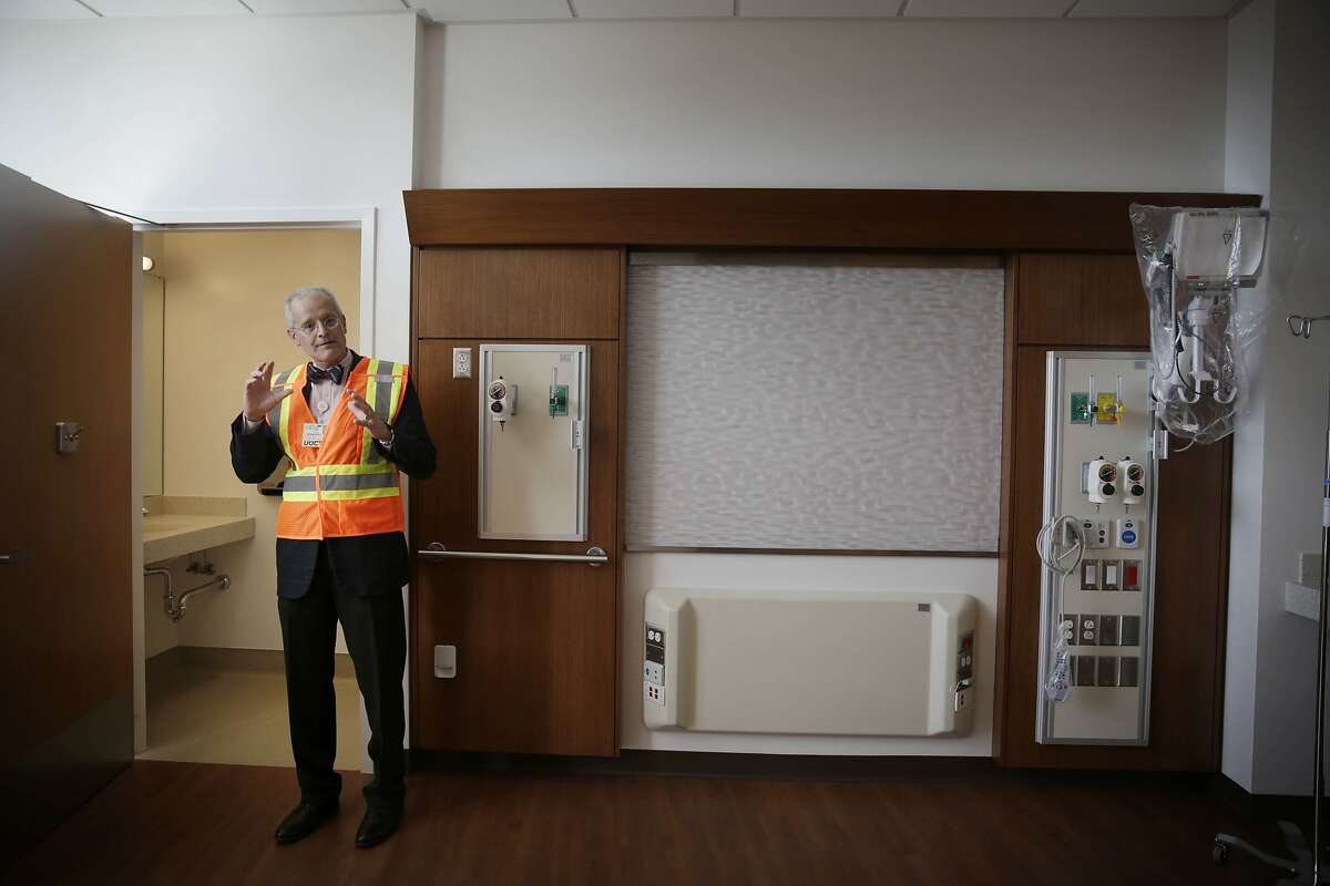 Edgar Pierluisssi, director Acute Care for the Elders Unit, Zuckerberg San Francisco General, shows a patient room in the Acute Care for Elders Unit during a tour at the Priscilla Chan and Mark Zuckerberg San Francisco General Hospital and Trauma Center on Tuesday, November 17, 2015 in San Francisco, Calif.