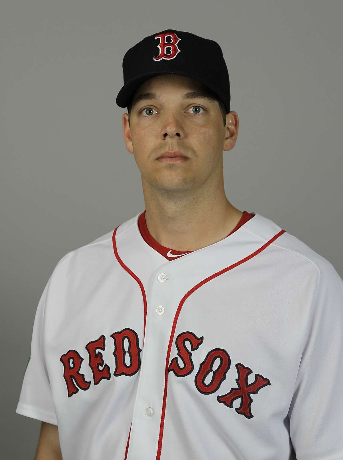 FILE - This is a 2012 file photo showing Boston Red Sox baseball player Rich Hill. Hill starts spring training with a heavy heart. Hill reported to Boston's camp on Thursday, March 6, 2014, following the death of son Brooks, who was less than 2 months old when he died on Feb. 24. (AP Photo/David Goldman/File)