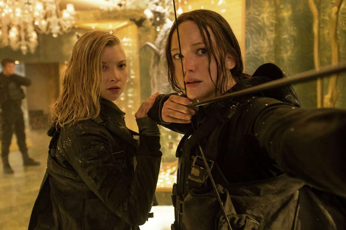 This image released by Lionsgate shows Natalie Dormer as Cressida, left, and Jennifer Lawrence as Katniss Everdeen in a scene from "The Hunger Games: Mockingjay Part 2." (Murray Close/Lionsgate via AP)