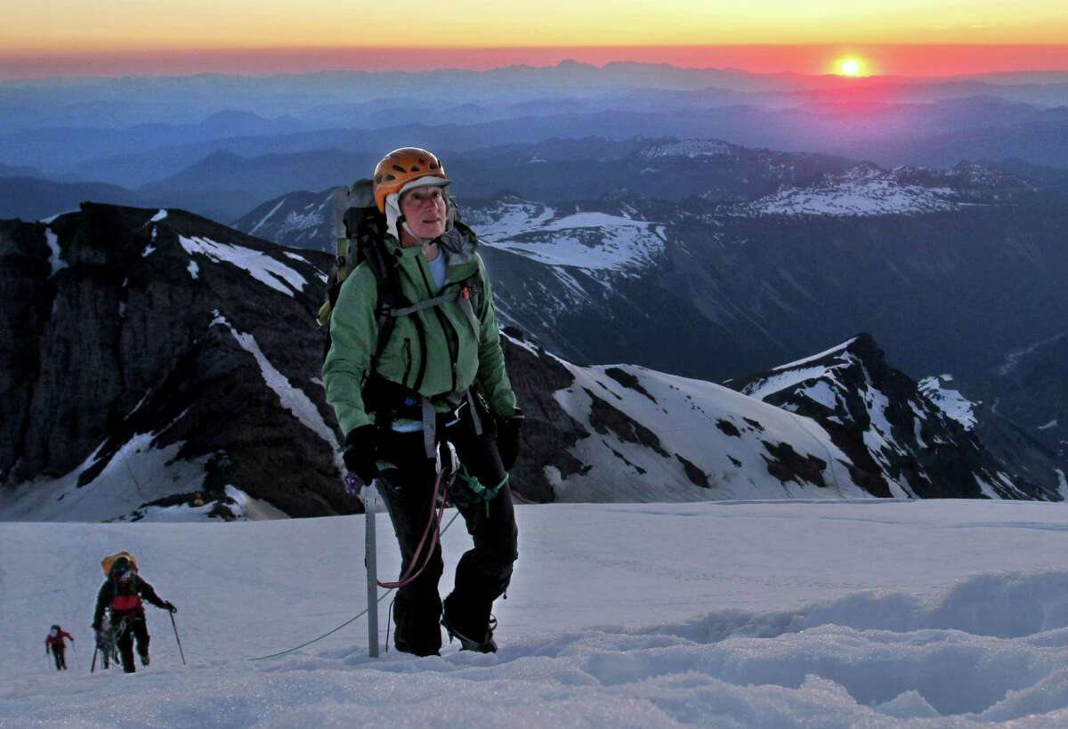 In a July 9, 2010 photo, Sally Jewell, CEO of REI, leads a five-woman team up the Emmons Glacier and ultimately to the top of Mount Rainier as the sun rises. President Barack Obama has picked Jewell, a business executive who has earned national recognition for her support of outdoor recreation and habitat conservation, to lead the Interior Department, the White House said Wednesday, Feb. 6, 2013. (AP Photo/The News Tribune, Janet Jensen) MANDATORY CREDIT