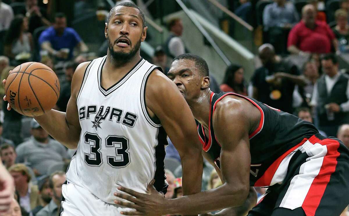 Boris Diaw gets away from defenderNoah Vonleh in the first half as Spurs host Portland at the AT&T Center on November 16, 2015.