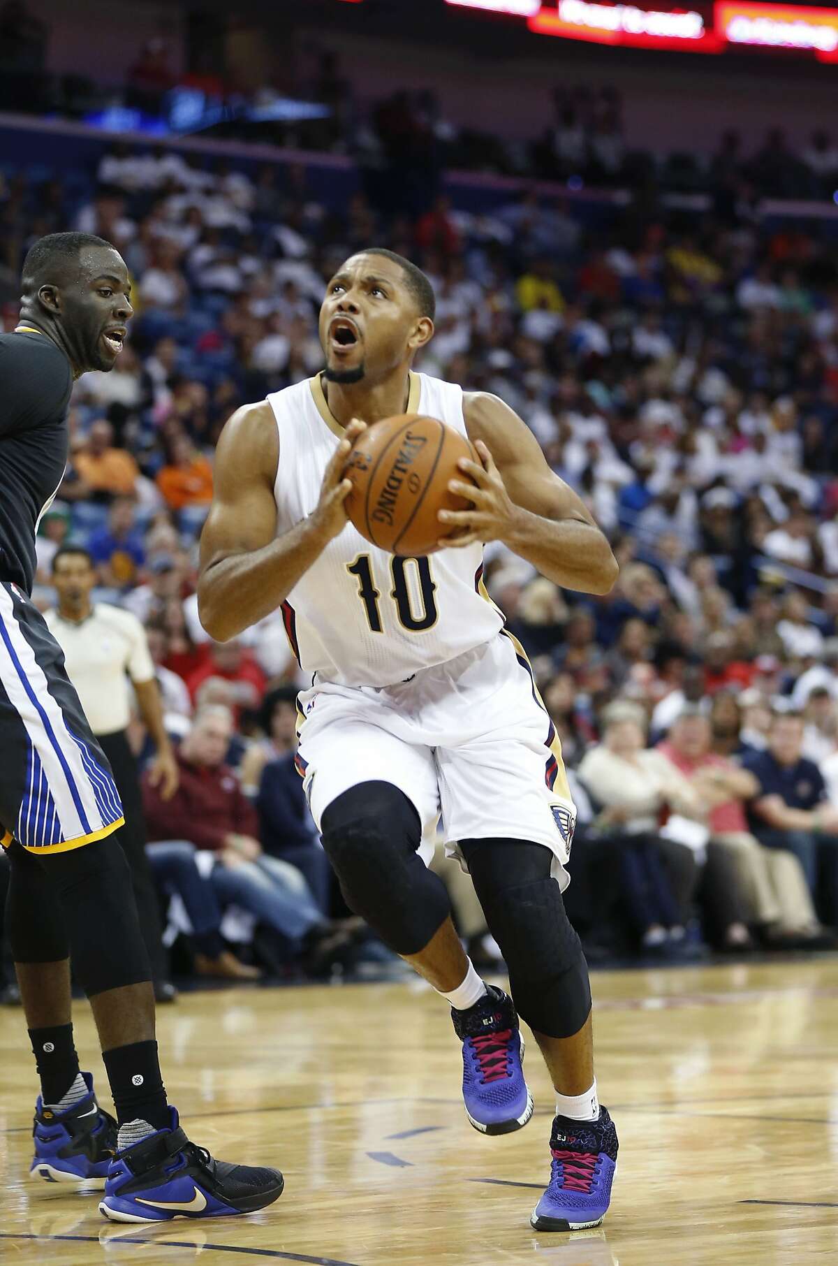 New Orleans Pelicans guard Eric Gordon (10) drives to the basket in the second half of an NBA basketball game against the Golden State Warriors in New Orleans, Saturday, Oct. 31, 2015. The Warriors won 134-120. (AP Photo/Gerald Herbert)
