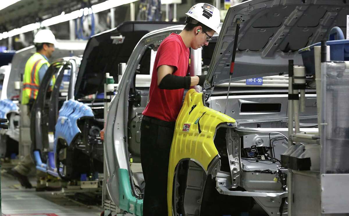 Workers assemble pickups at Toyota’s South Side plant. The auto industry’s light truck sector, which includes pickups and SUVs, “surged” in 2015, Toyota executive Fay said in the conference call Tuesday, calling it “perhaps the biggest story of the year.”