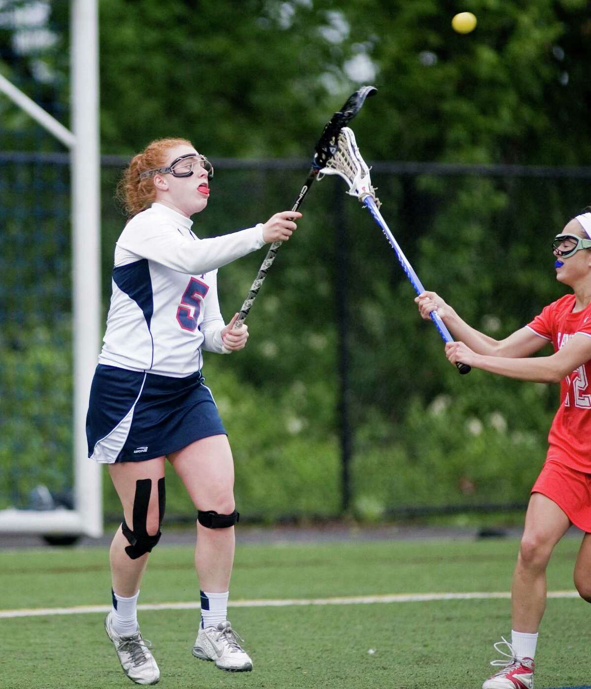 FILE PHOTO: New Fairfield High School's Brooke Baldelli passing the ball in the Girls Lacrosse-M game against Branford High School, played at New Fairfield. Tuesday, June 2, 2015
