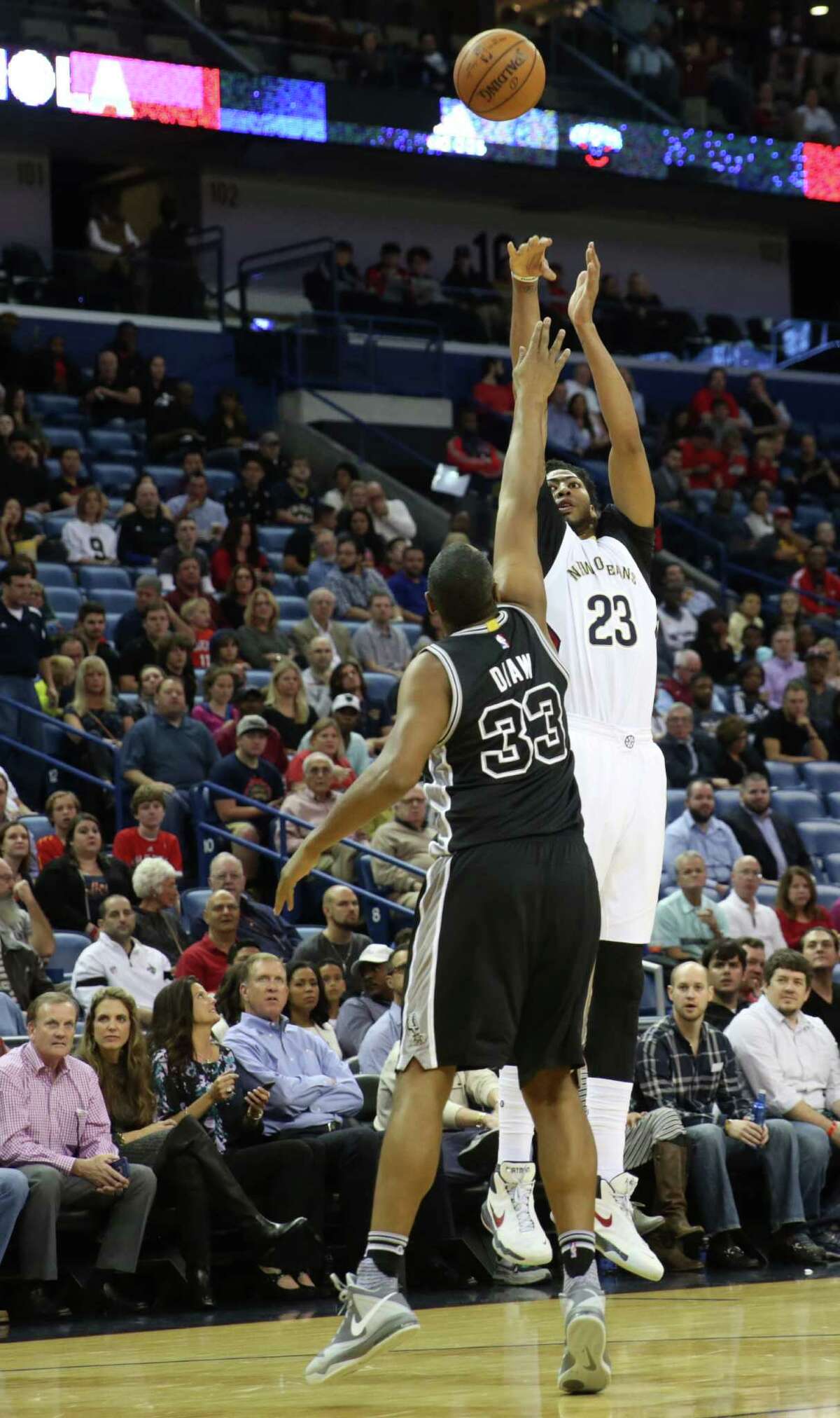 2277 x 3840~~$~~New Orleans Pelicans forward Anthony Davis (23) releases a 3-point shot over San Antonio Spurs center Boris Diaw (33) during the first half of an NBA basketball game in New Orleans, Friday, Nov. 20, 2015.