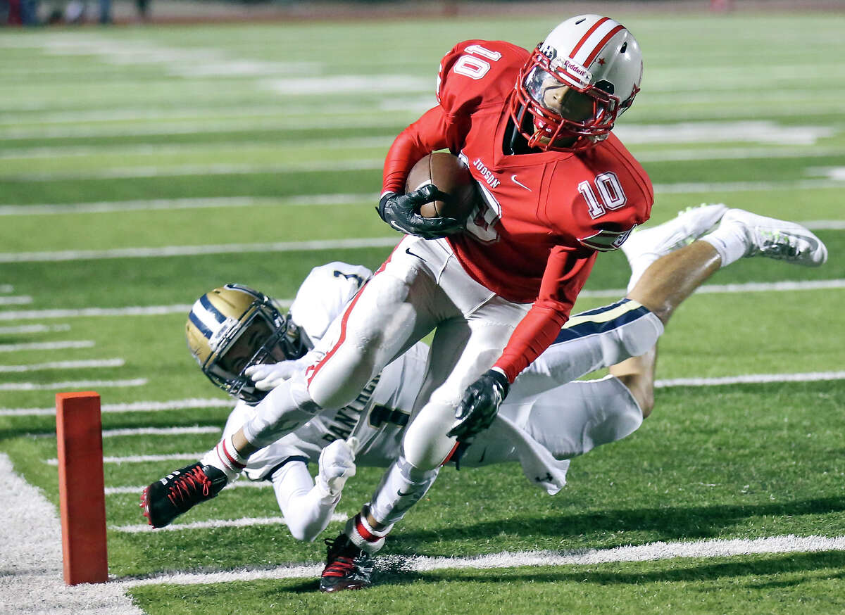 Judson's Joshua West scores a touchdown around O'Connor's Jonathan Tapia during second half action Friday Nov. 20, 2015 at Rutledge Stadium. Judson won 56-28.