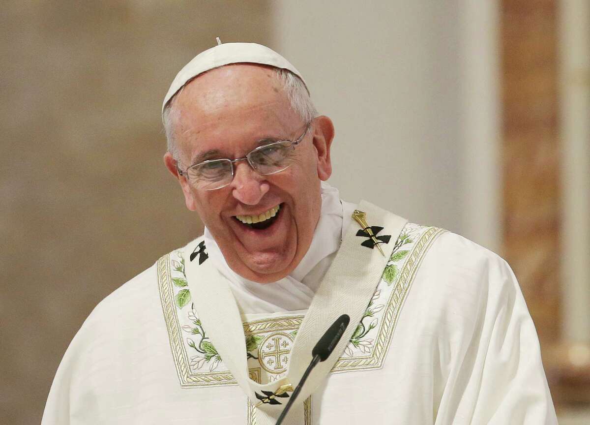 FILE - In this Friday, Jan. 16, 2015 file photo, Pope Francis laughs at the start of his homily during a mass with clergy at the Cathedral Basilica of the Immaculate Conception during his visit in Manila, Philippines.