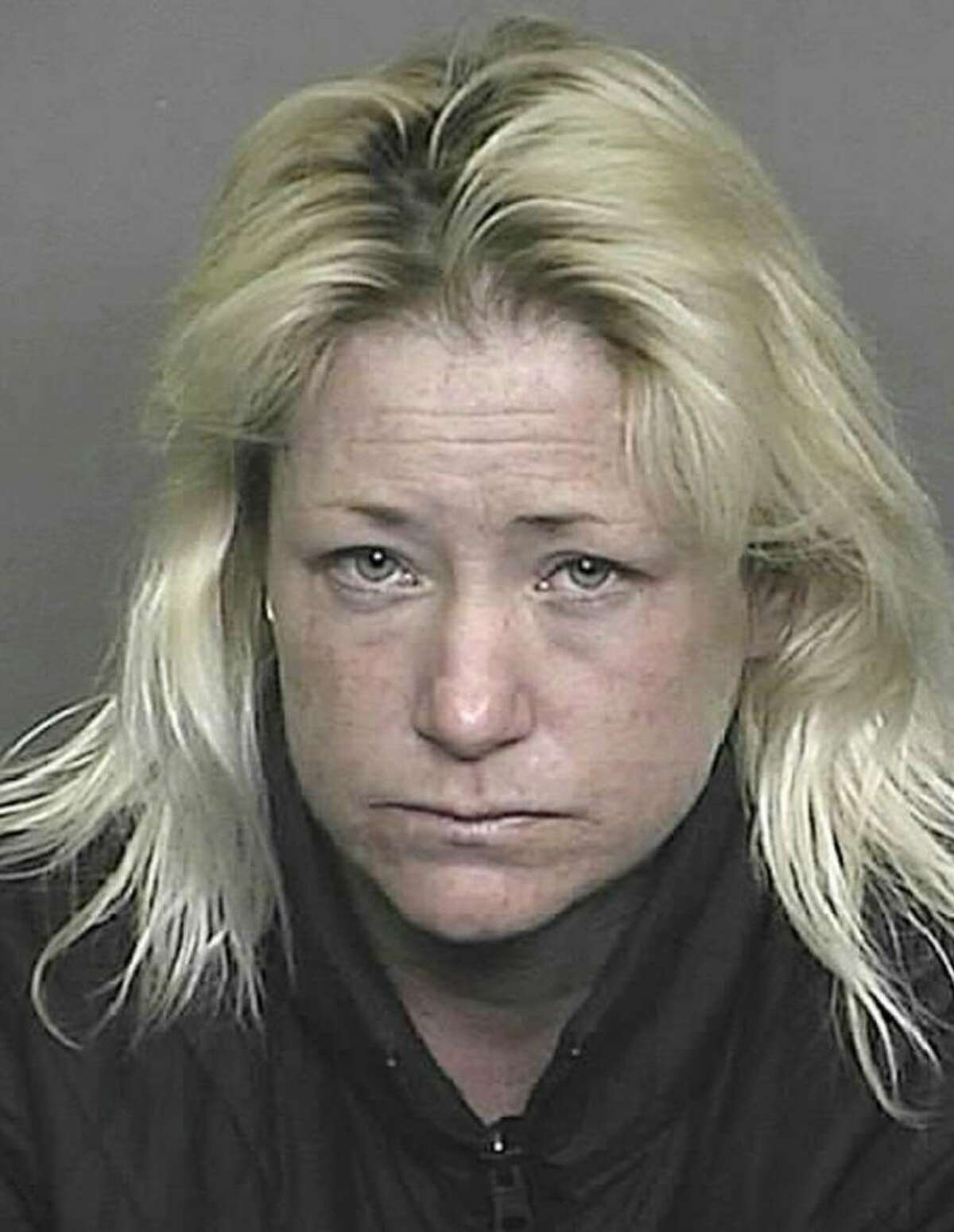 The trial has begun for Sandra Lee Jacobson, a Colorado woman shown in this January 2009 Denver police photo, who accused of driving drunk and killing two Greenwich librarians last year near the Denver airport.