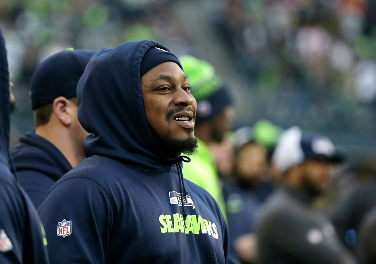 Seattle Seahawks running back Marshawn Lynch watches from the sideline during an NFL football game against the San Francisco 49ers, Sunday, Nov. 22, 2015, in Seattle. Lynch did not play in the game.